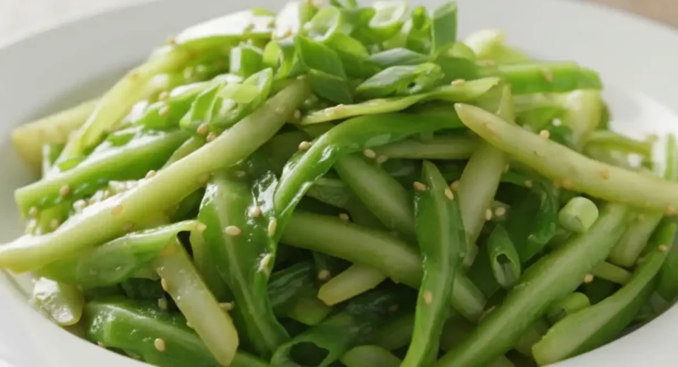 Thin shredded cabbage wok-fried soy ginger crisp.