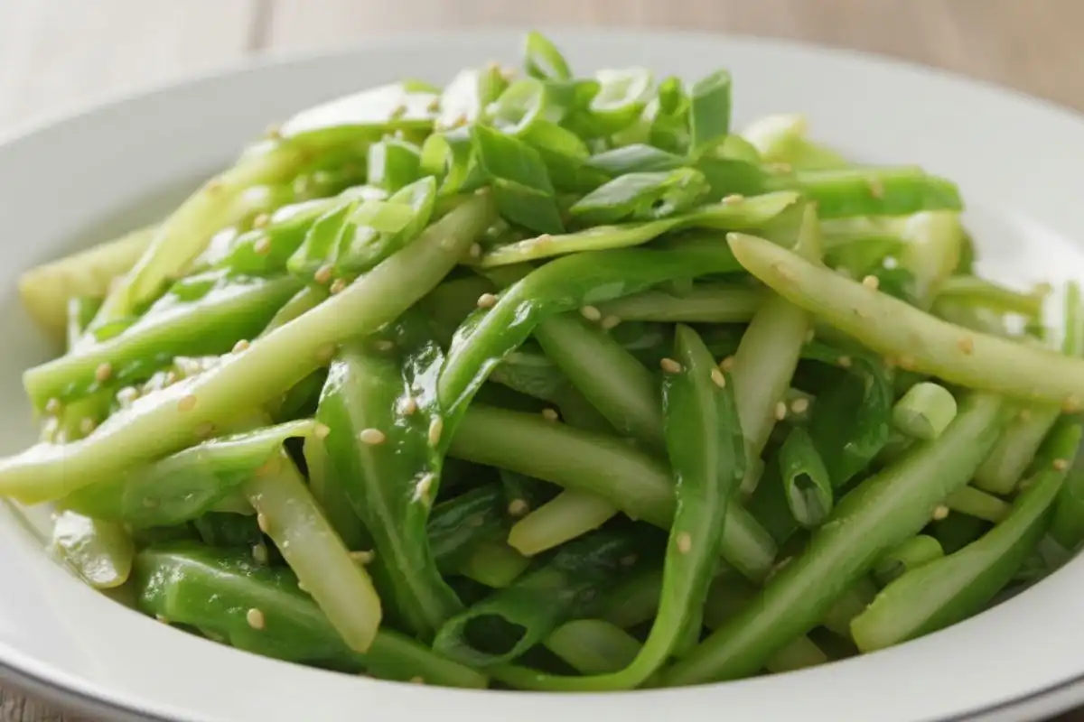 Thin shredded cabbage wok-fried soy ginger crisp.